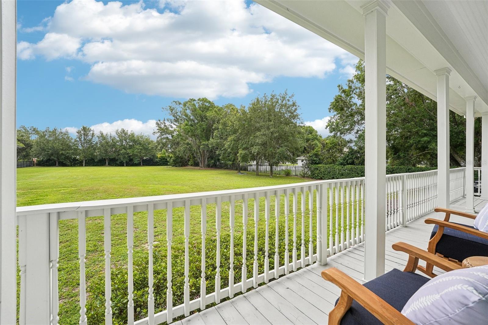 Wrap around porch and Large Iron Fenced lot with tons of options