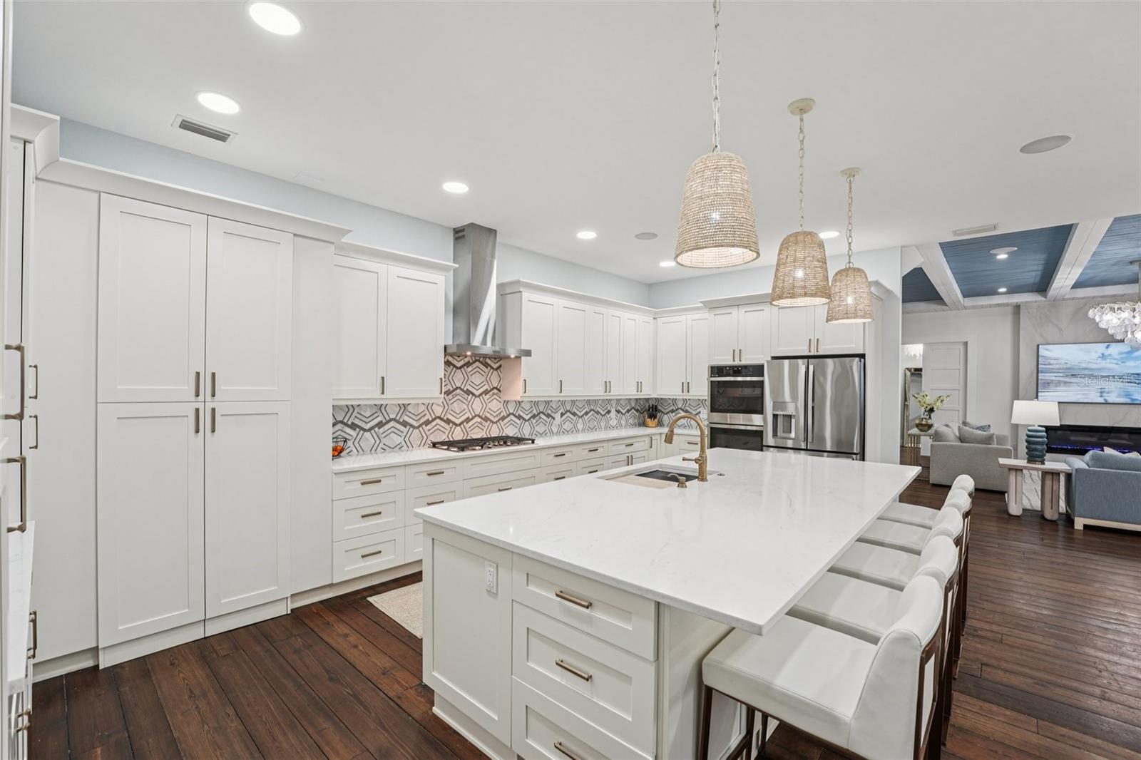 Custom designed Kitchen with hidden entance to the pantry and Laundry room