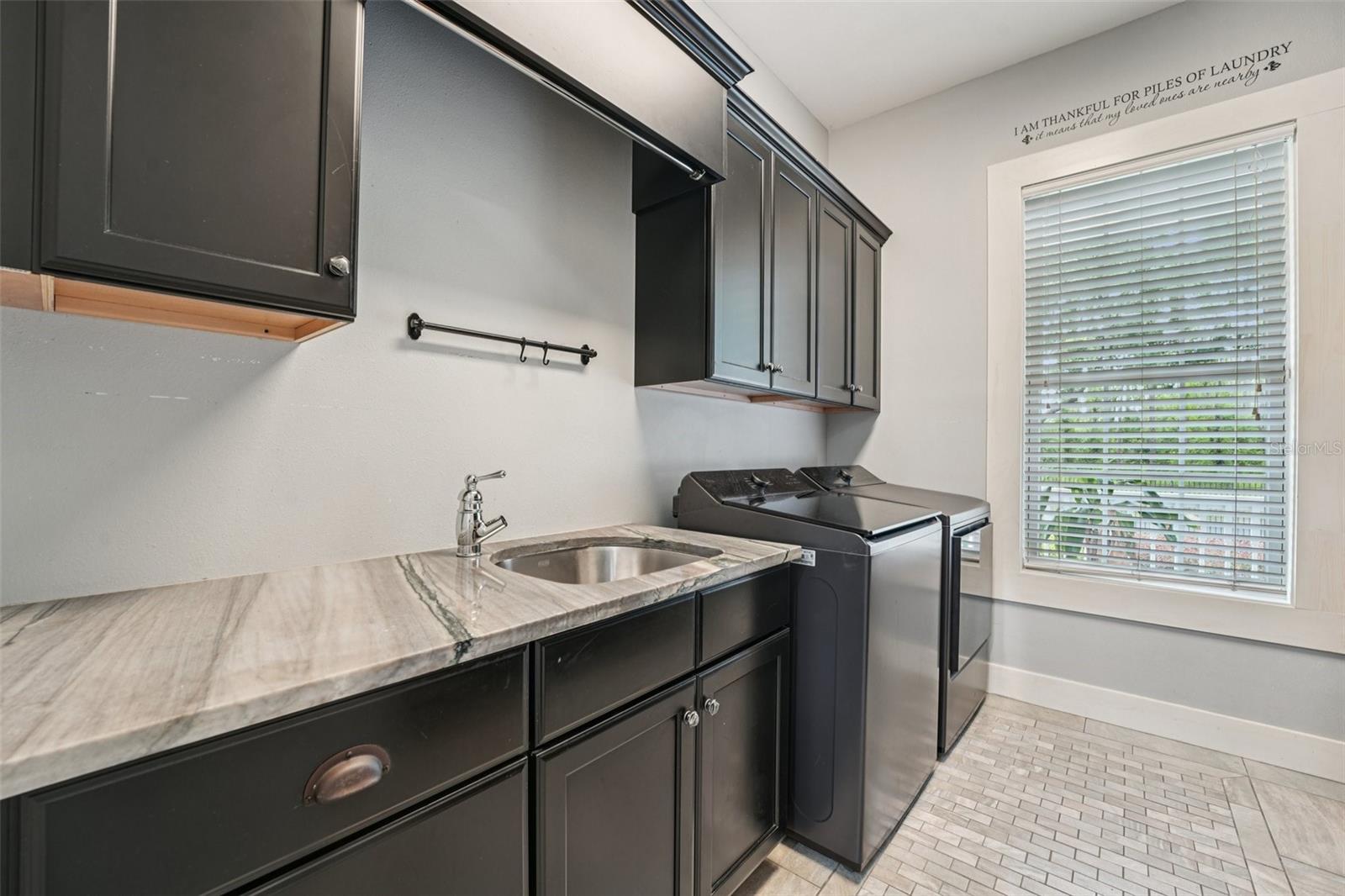 Hidden Laundry room with storage and pantry