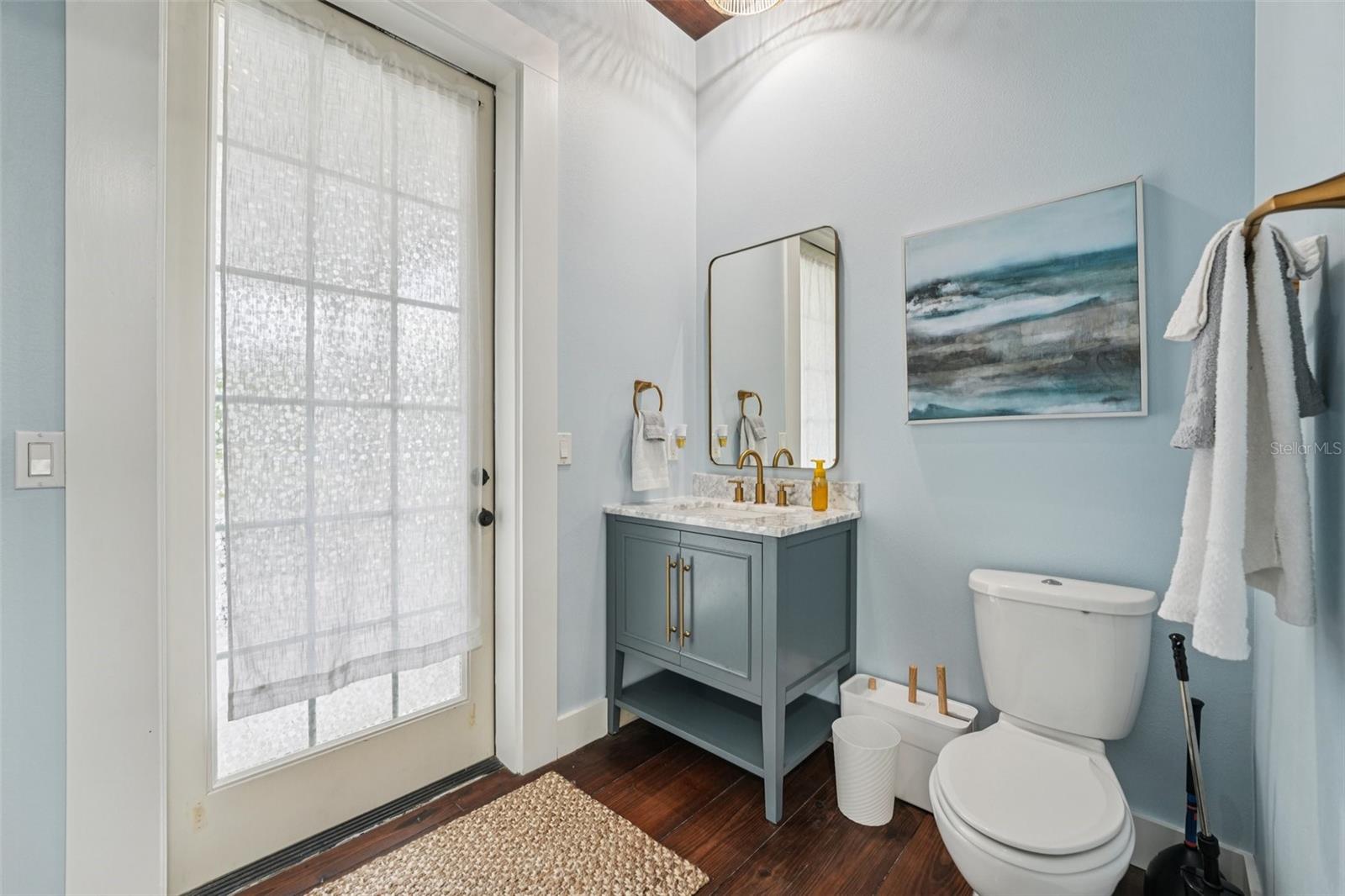 1/2 bath off the kitchen with access to outside patio