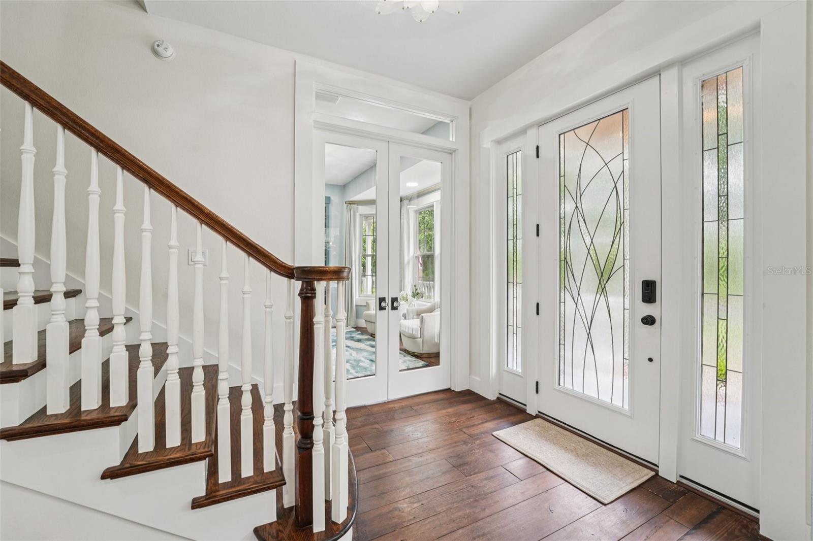 Entry way with view of office Glass French Doors