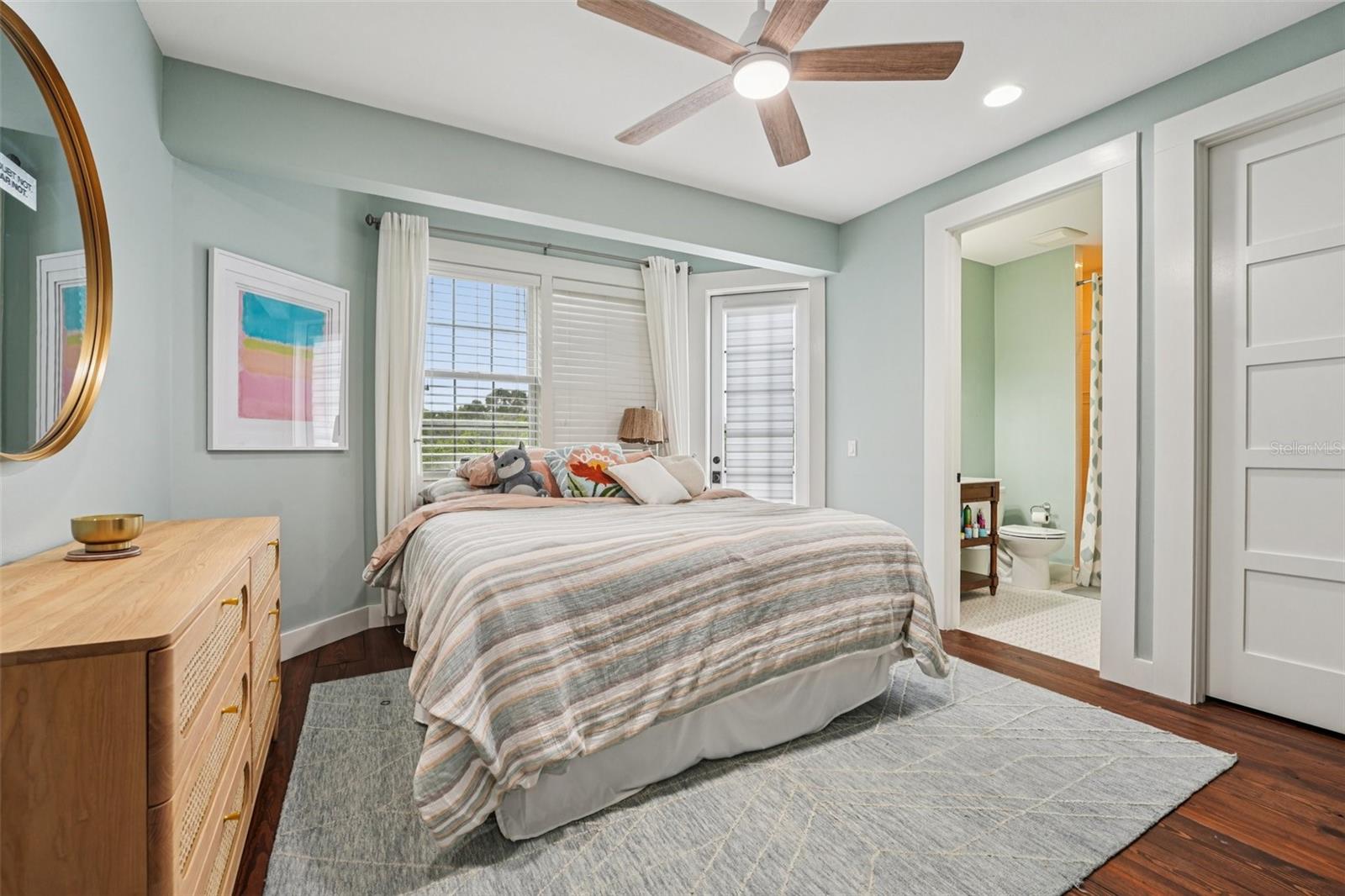 Upstairs bedroom 1 with Balcony overlooking the pool, private bath and walk in Closet