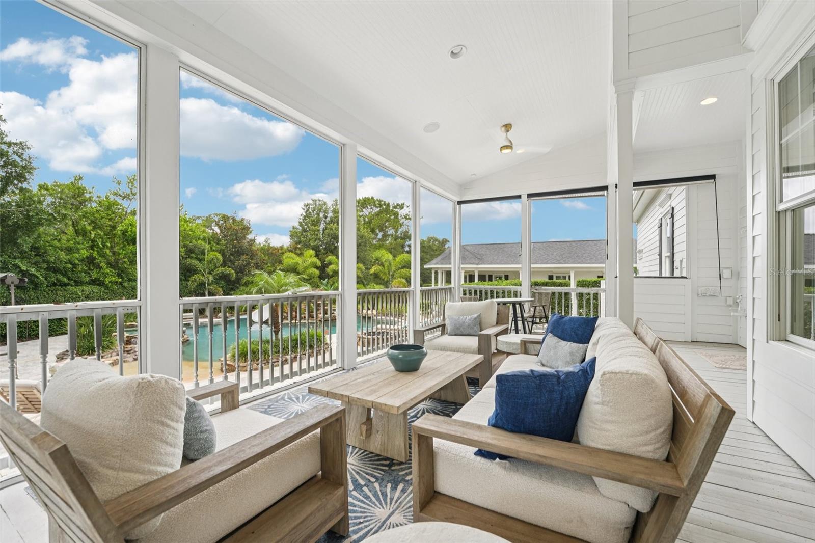 Covered and screen back patio overlooks the pool