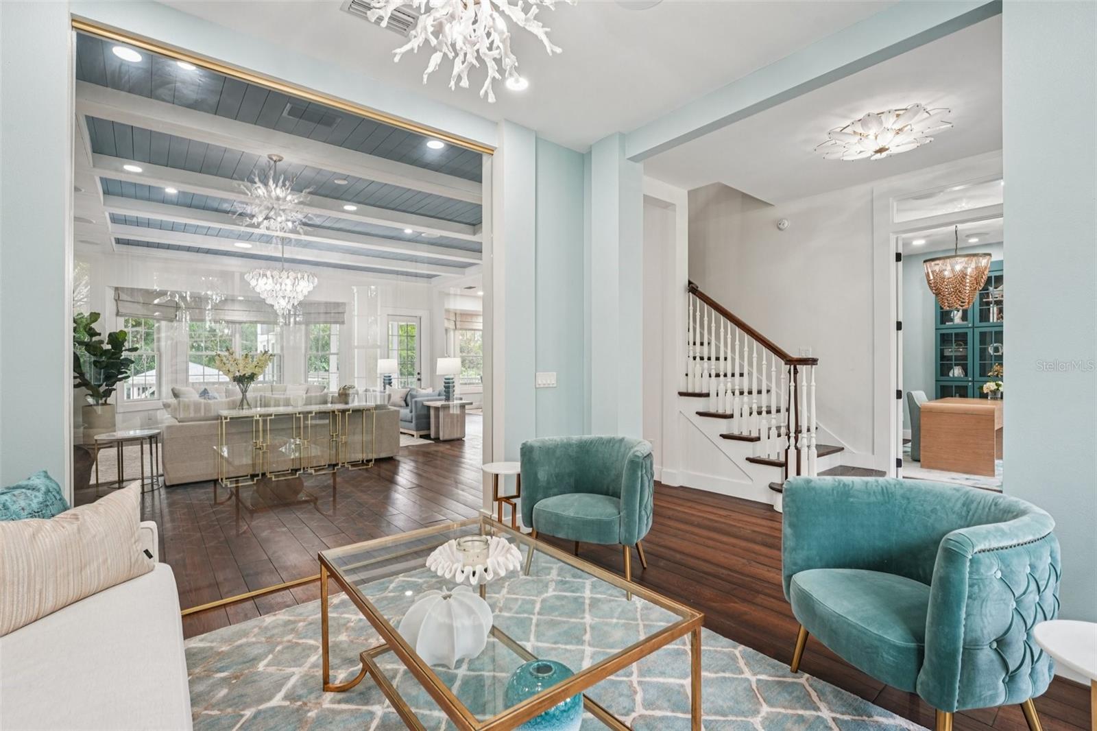 Glass wall separating the sitting room from the family room