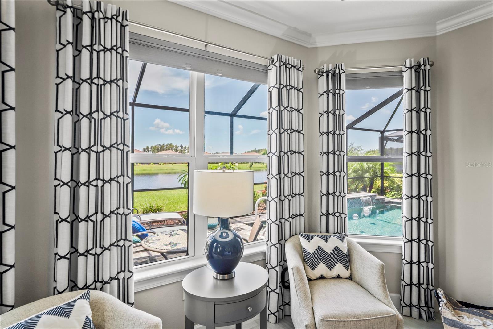 Bay window view looking out to pool from Primary