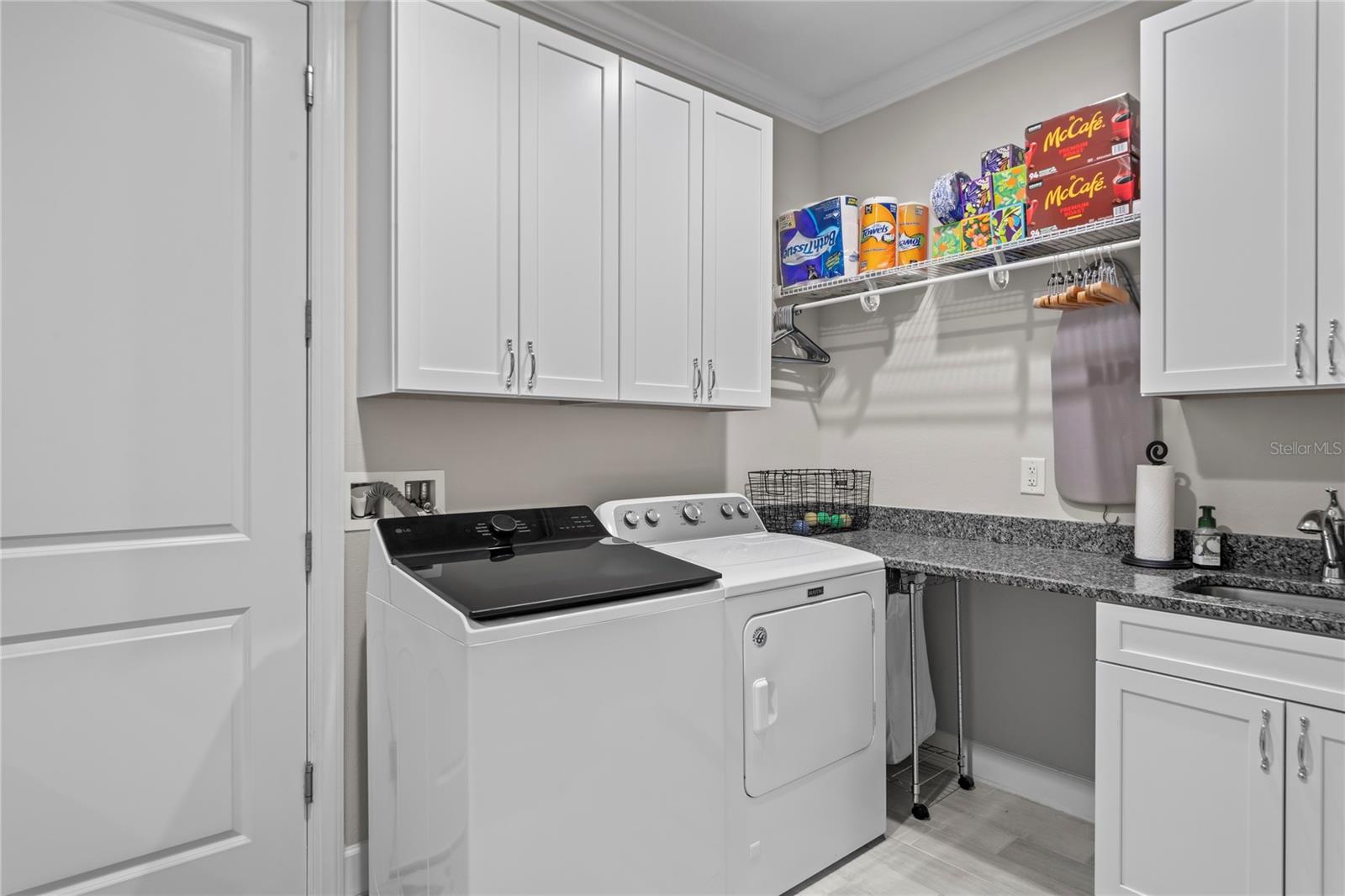 Laundry room with durable cabinetry and sink