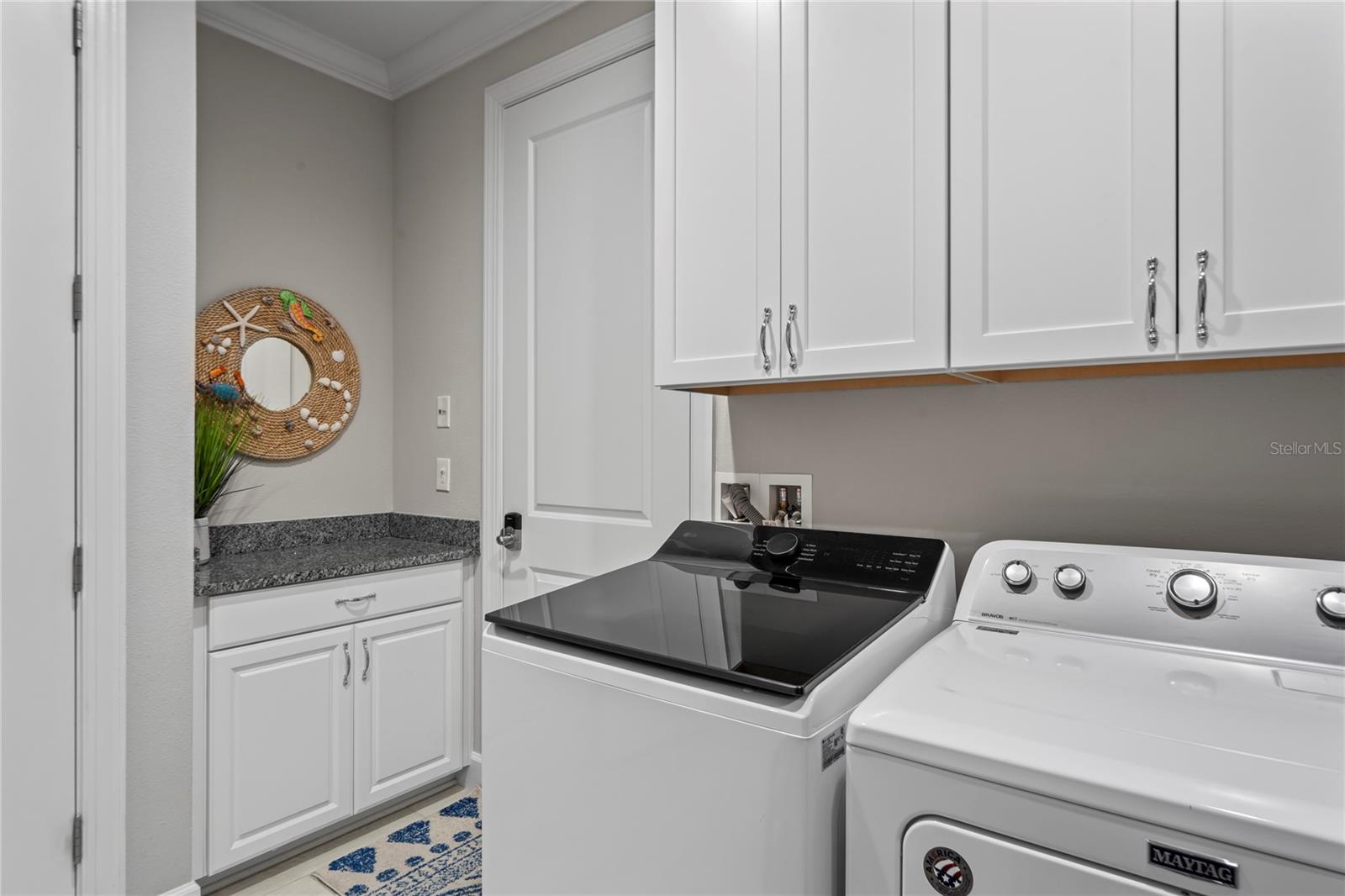 Washer and dryer with drop zone counter space