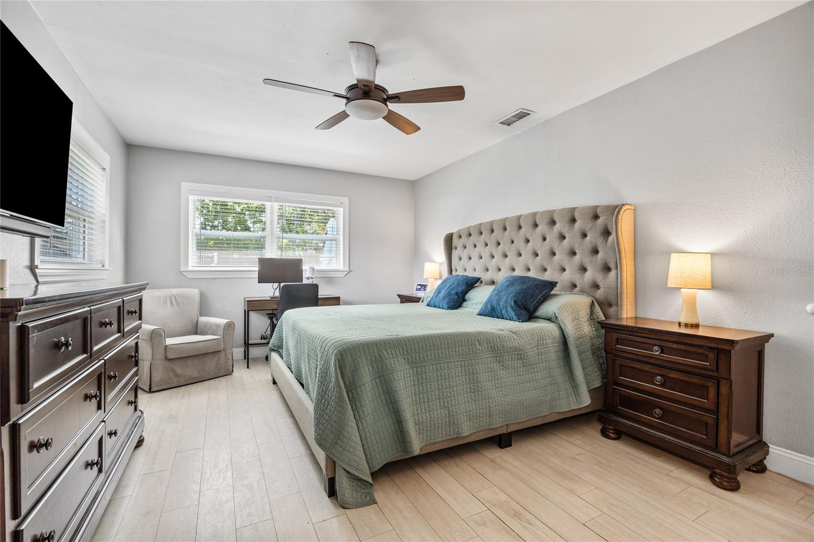 The Primary Bedroom offers a spacious and serene retreat with abundant natural light and room for a reading nook or workstation.