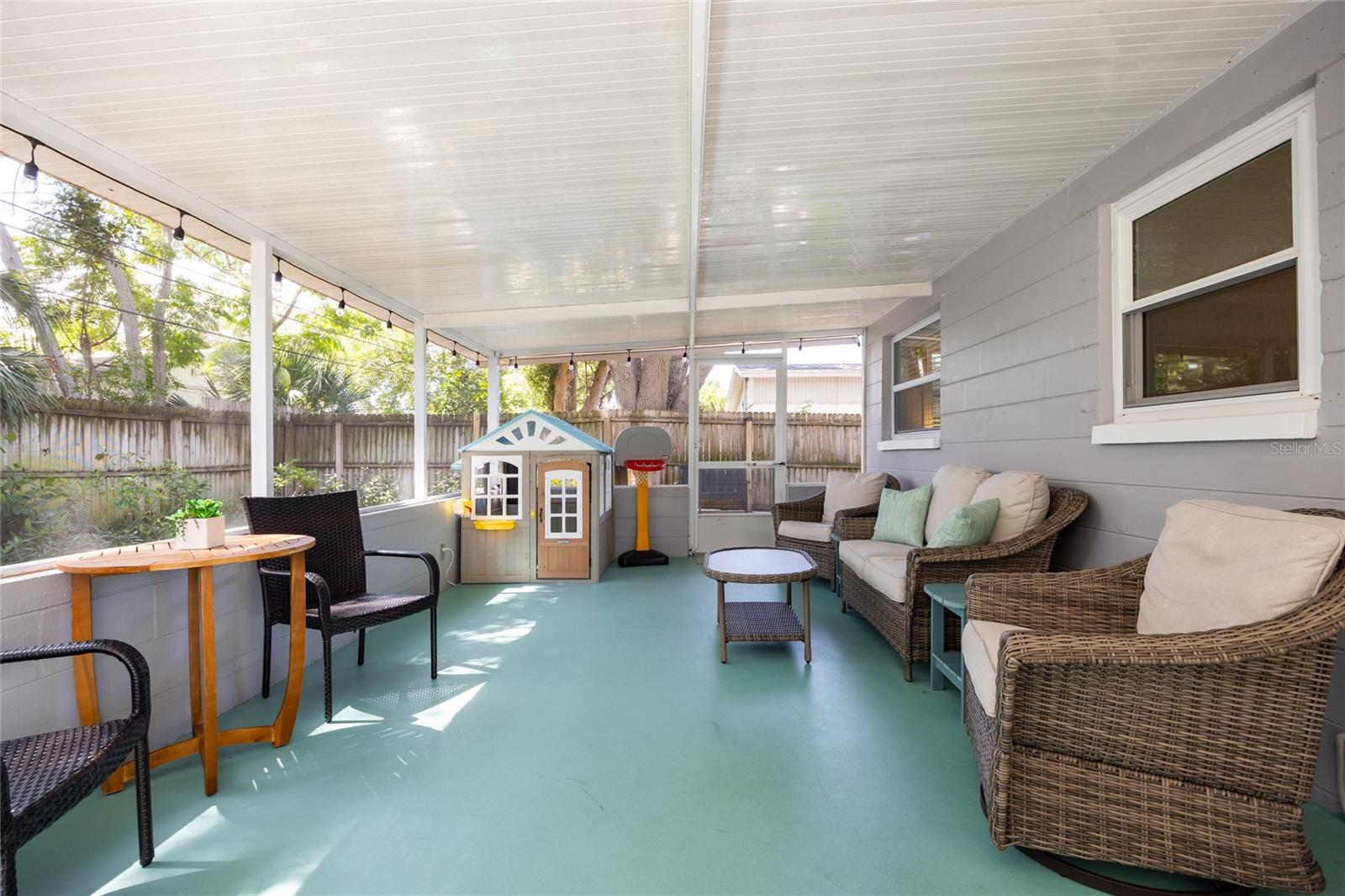 Relax bug-free in this oversized screened lanai—great for entertaining, playtime, or lounging in the breeze.