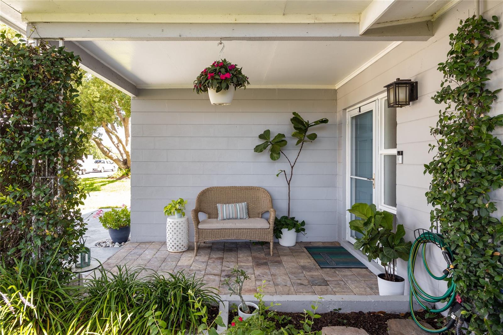 This beautiful covered front porch welcomes you into the home!