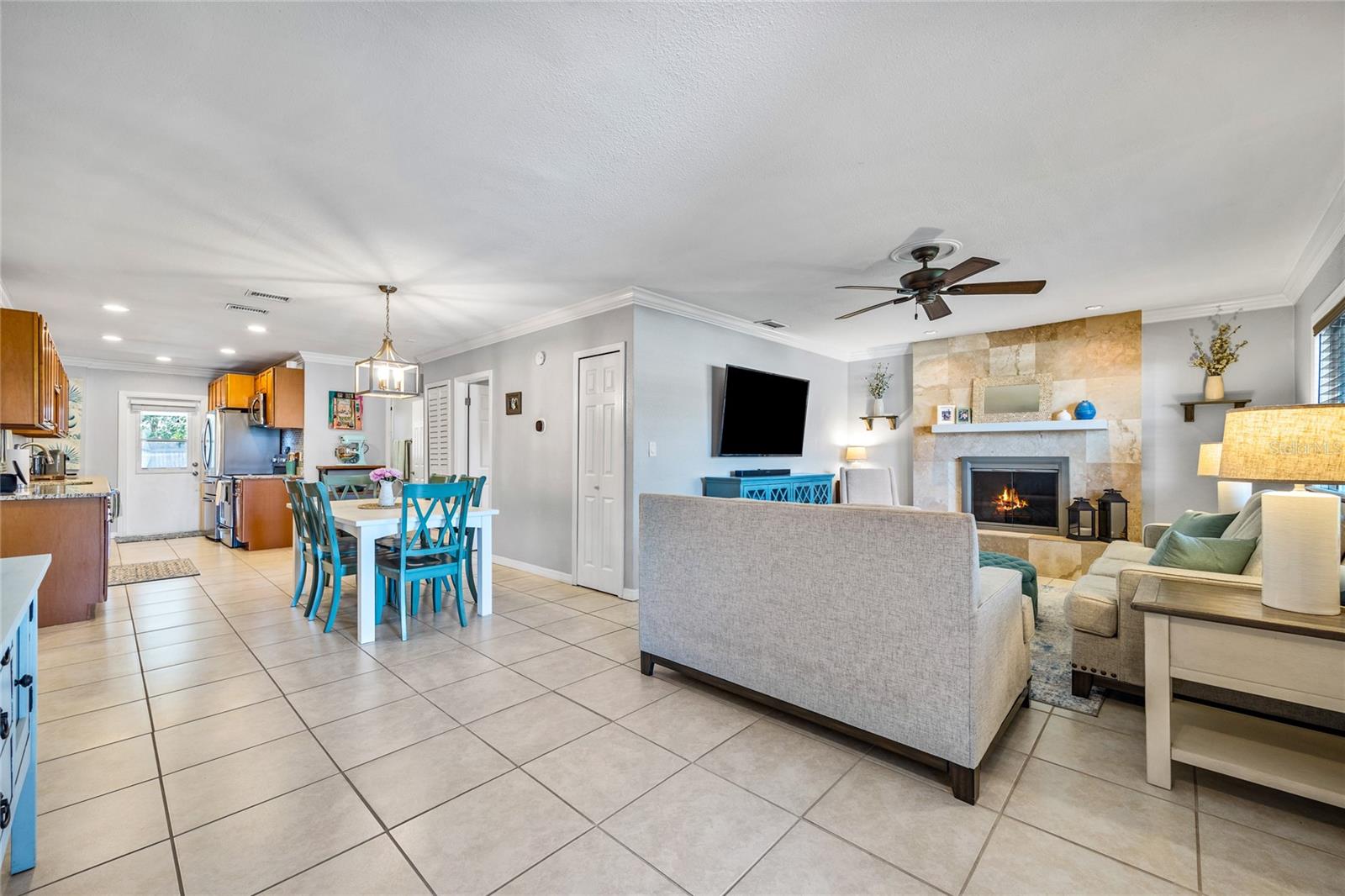 Open-concept living with a cozy fireplace and spacious kitchen—perfect for everyday comfort and effortless entertaining!