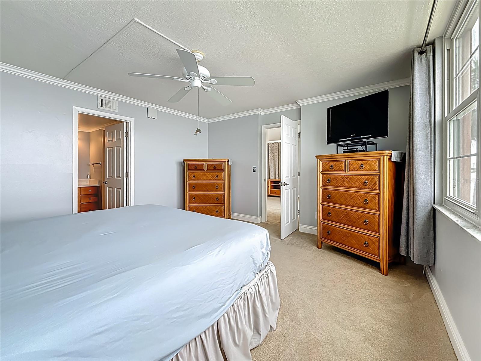 This view shows how nice and spacious the primary bedroom is.