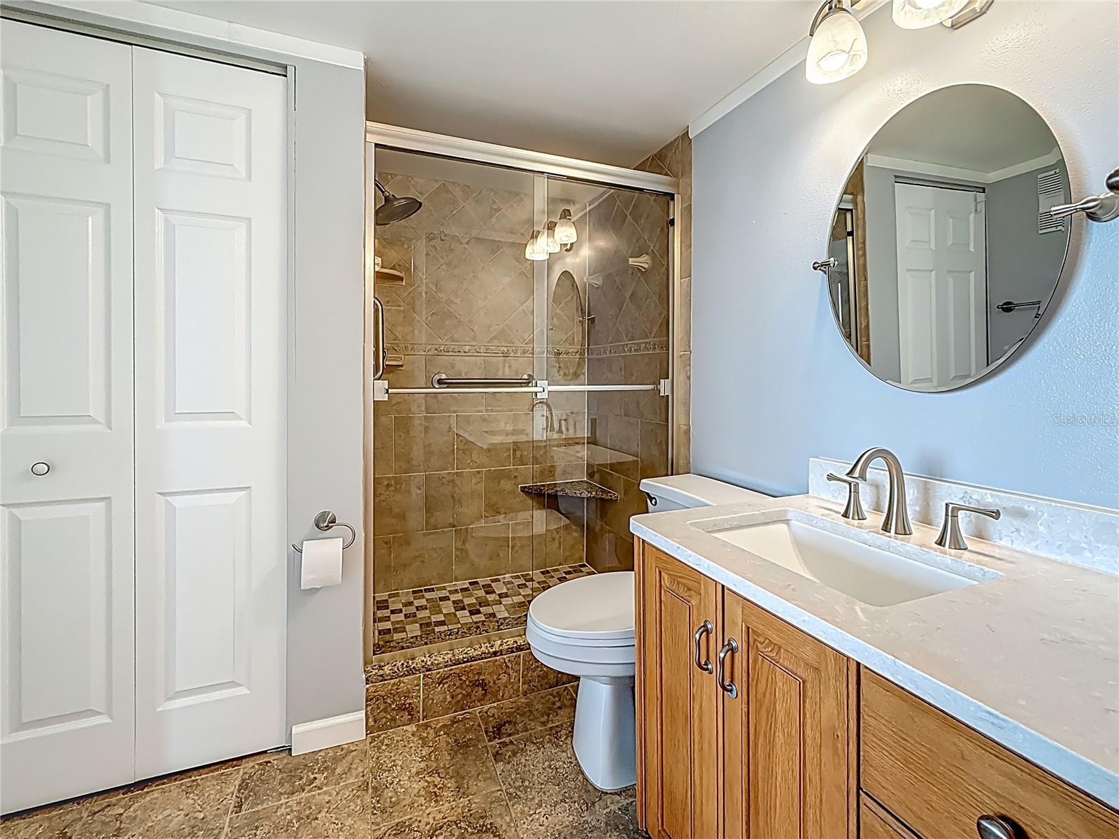 Updated primary bathroom with a shower and higher height vanity.