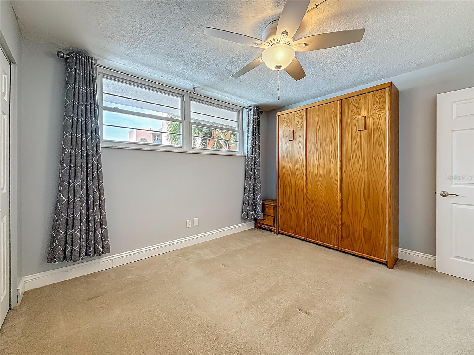 This bedroom with the Murphy bed is spacious and could offer many possibilities for different uses.