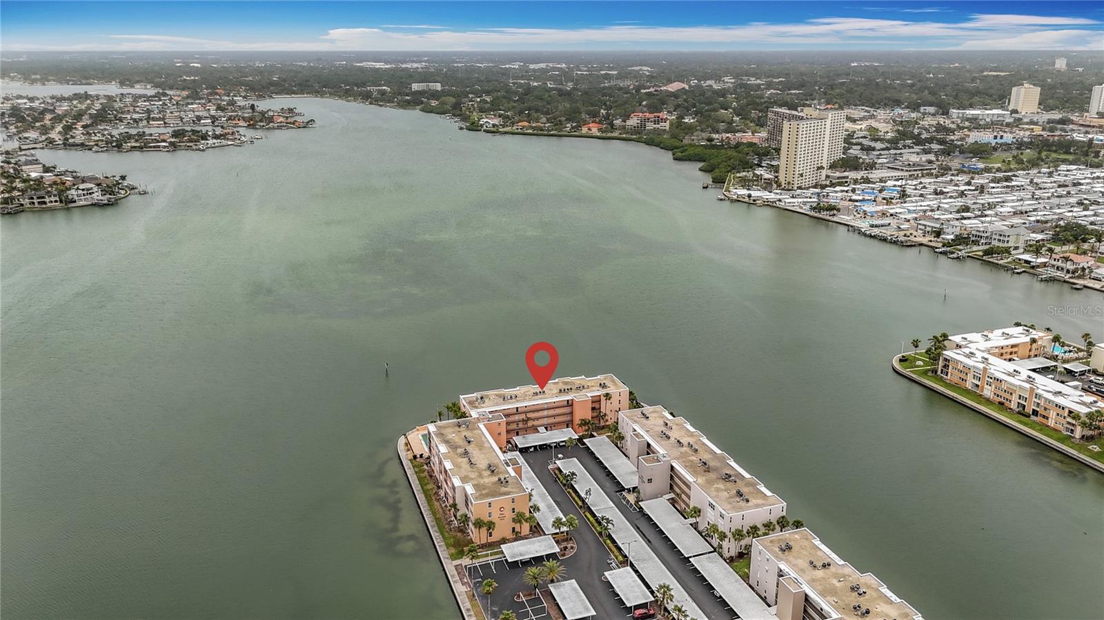 This aerial shows how nicely situated the building is with open water views.
