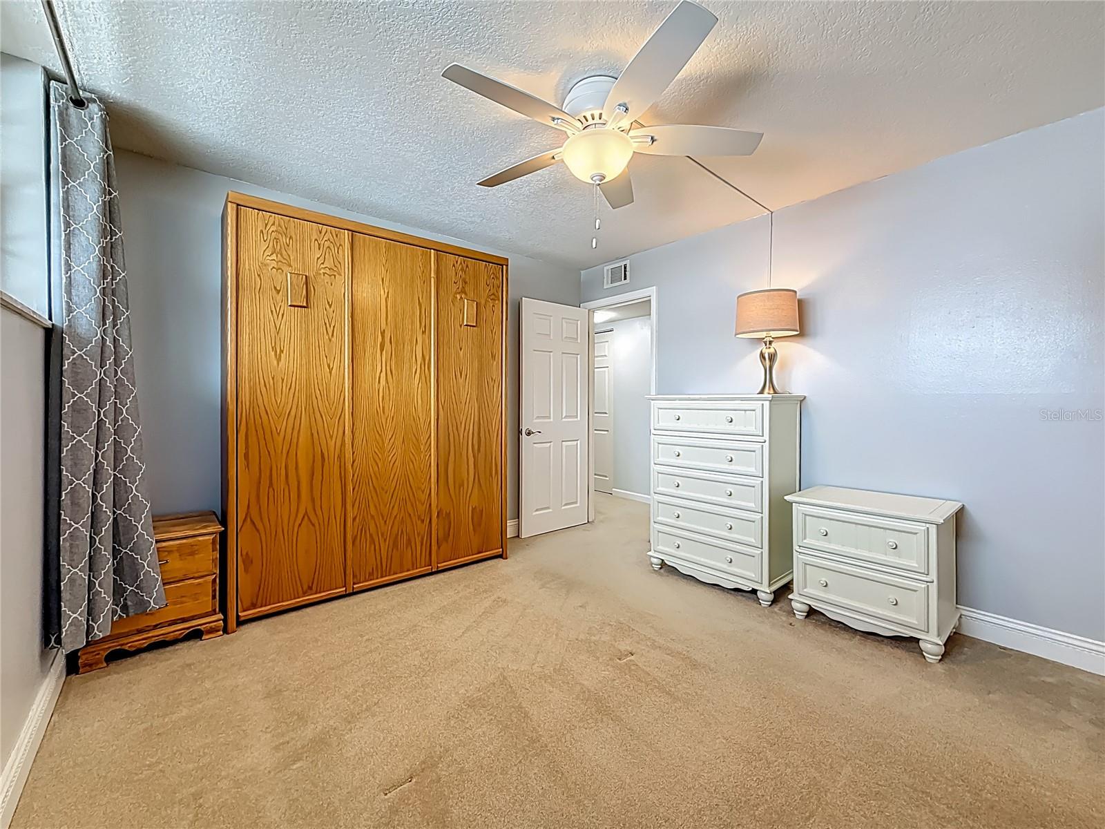 This is a guest bedroom, with a built-in murphy bed that conveys with the condo.