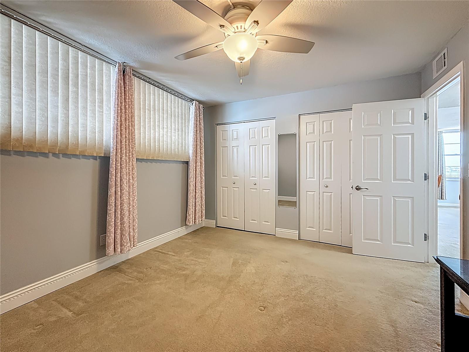 This bedroom is offers double windows for lots of light.