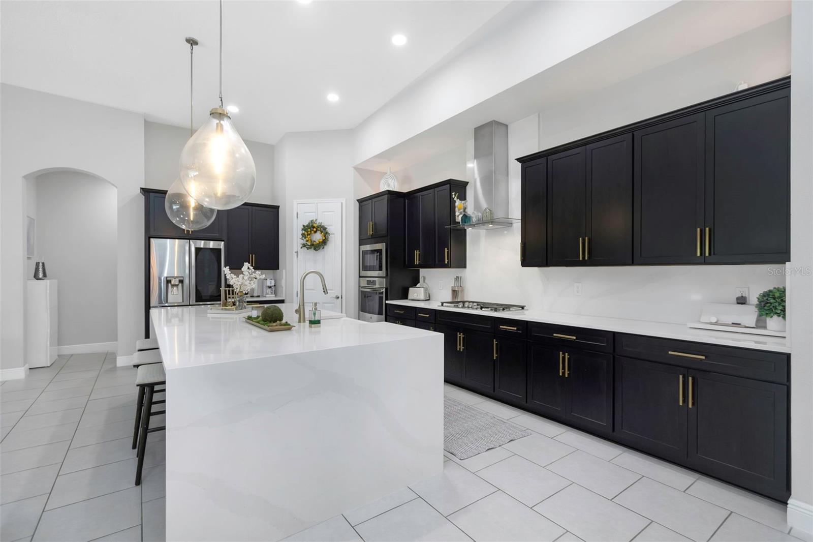 Waterfall kitchen Quartz countertop island with matching Back Splash