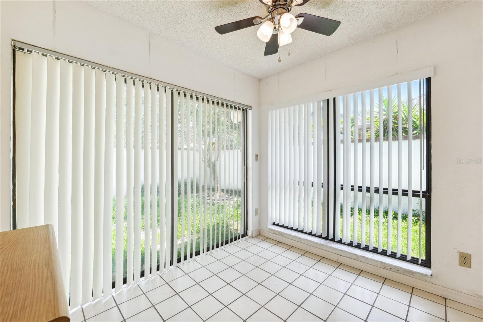 Breakfast nook area with slider that goes to the front yard/patio area.