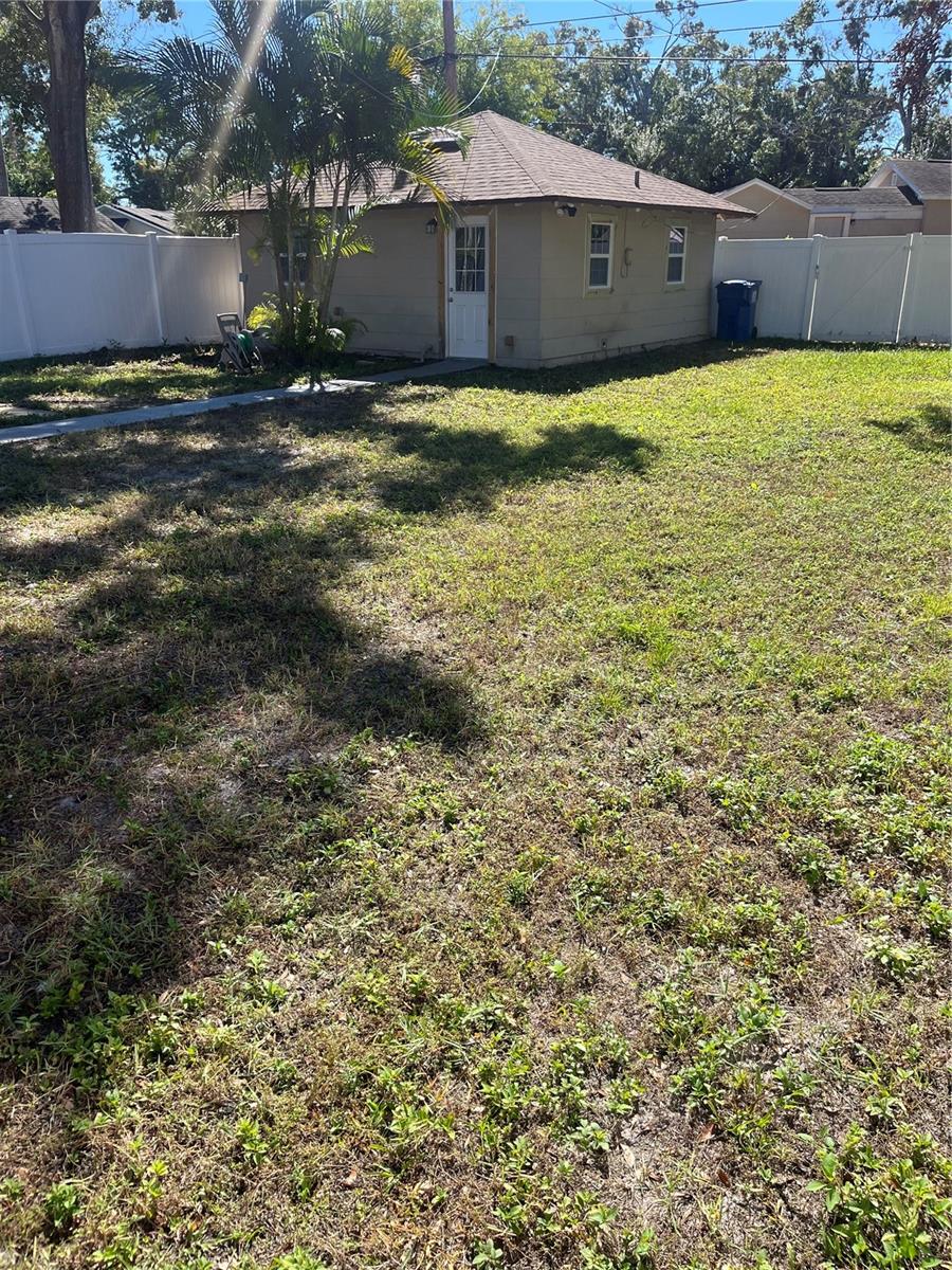 Detached two car garage with utilities is perfect for an ADU, Workshop or Home office :alley access.