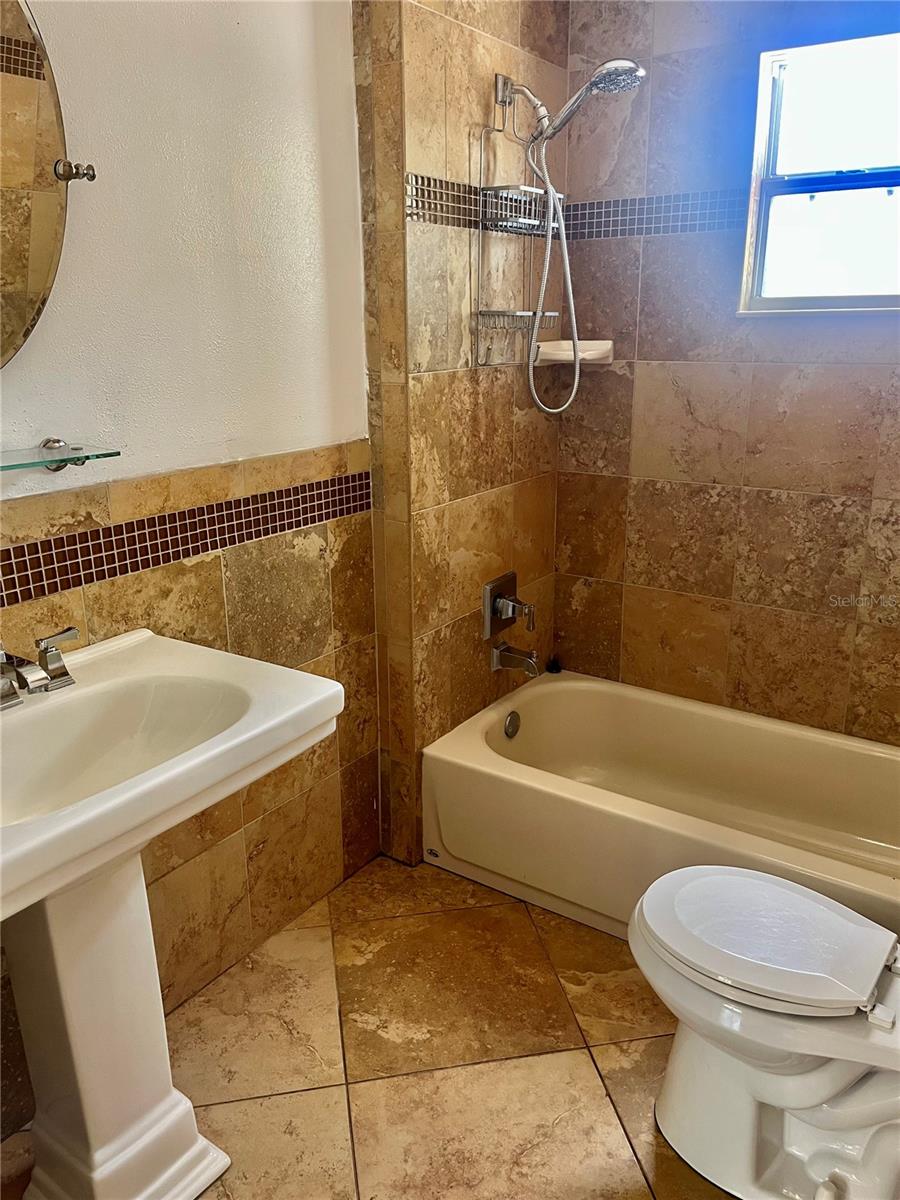 Remodeled bathroom with designer tile.