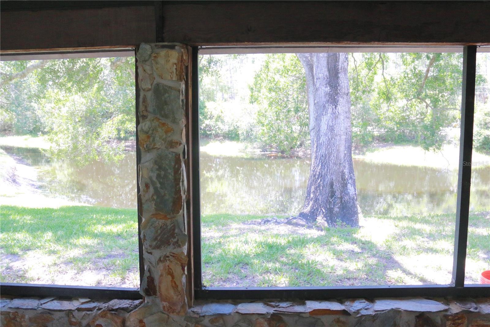 VIEW OF POND FROM SCREENED LANAI