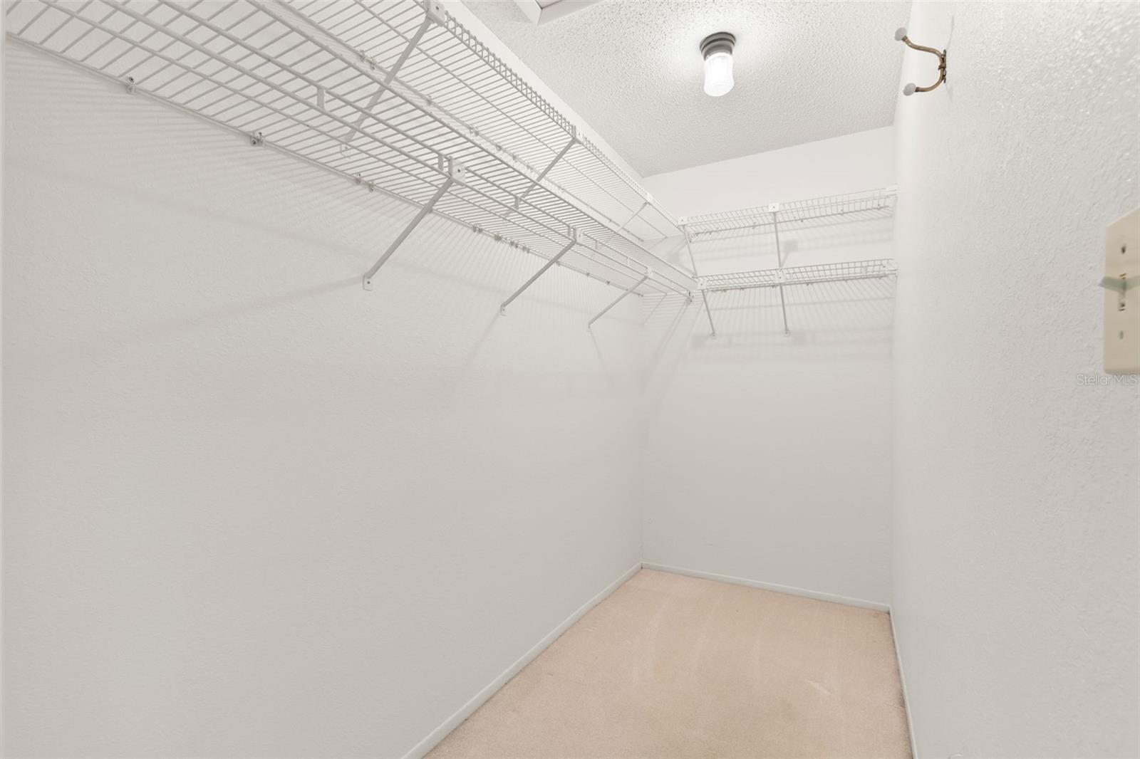 Walk-in closet in primary suite