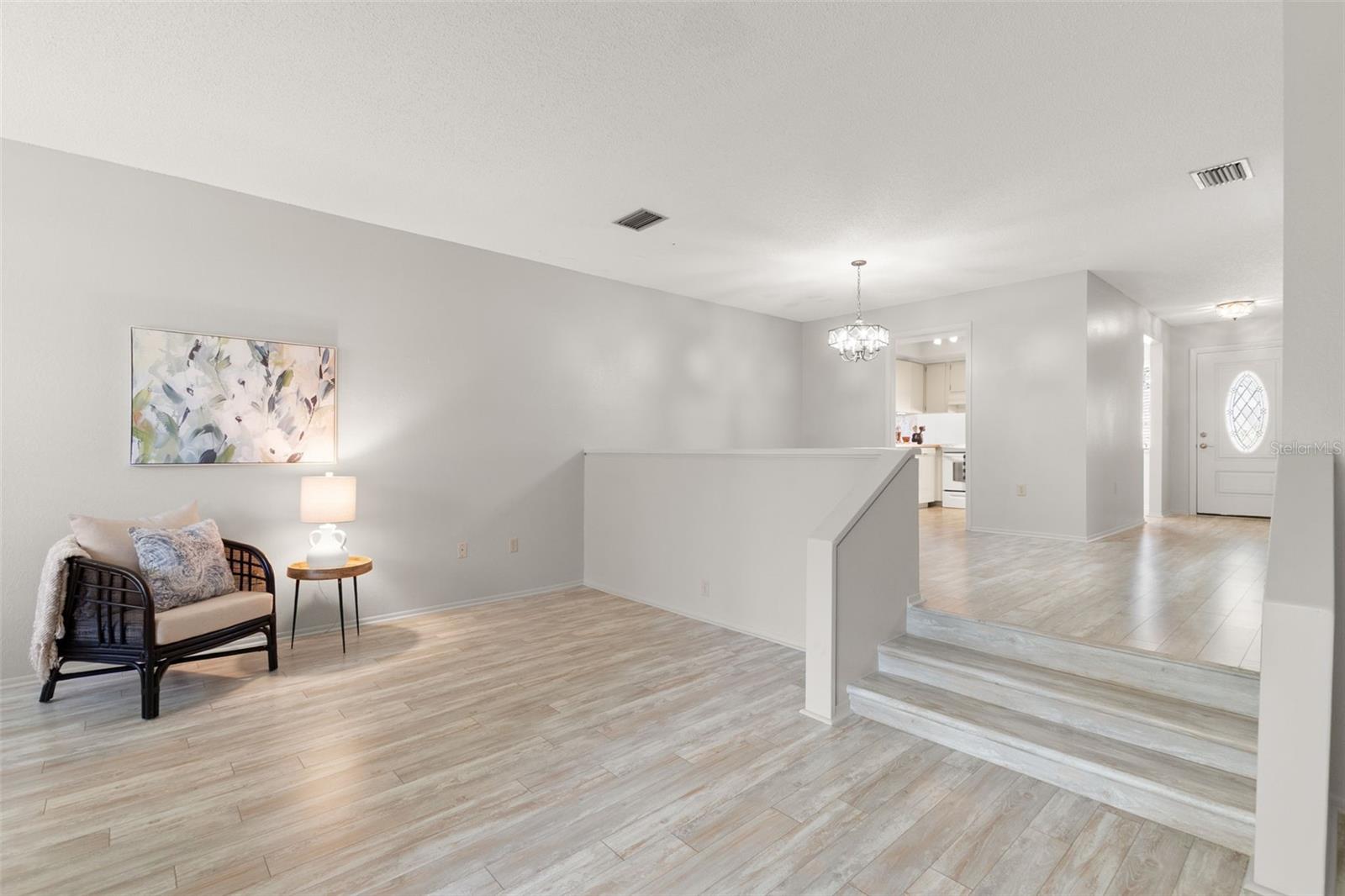 Living room with high volume ceilings