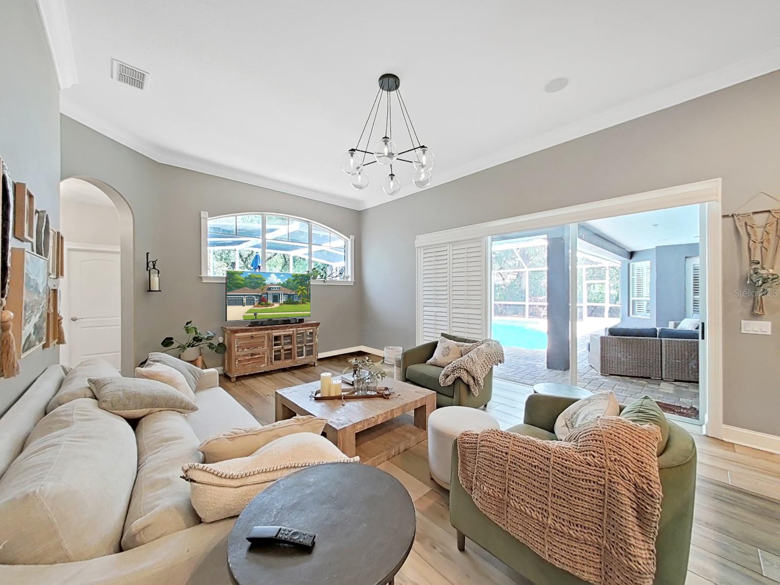 Family Room Opens to Covered and Screened Lanai with Sliding Pocket Doors