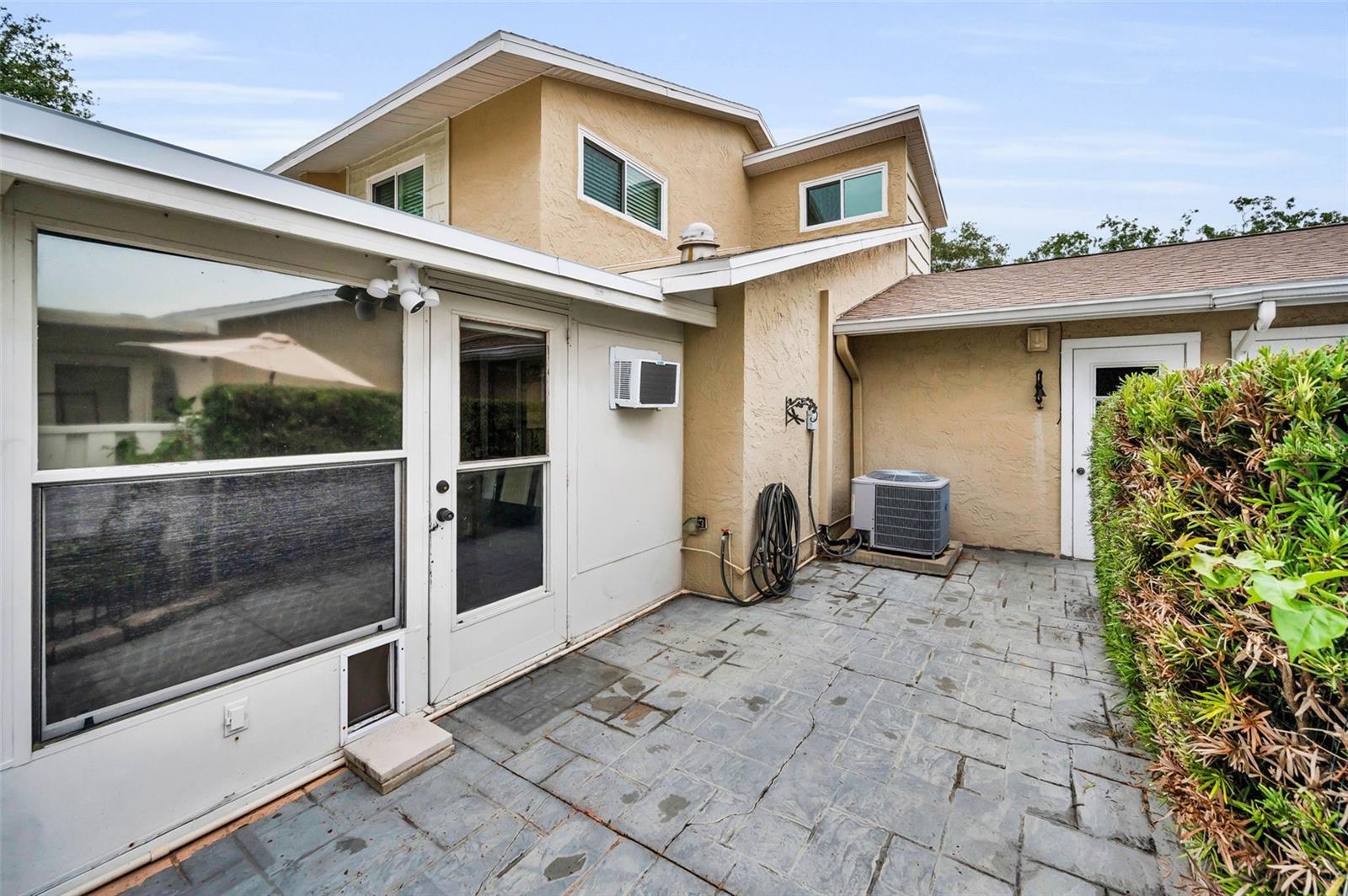 Backyard Patio leads into sunroom