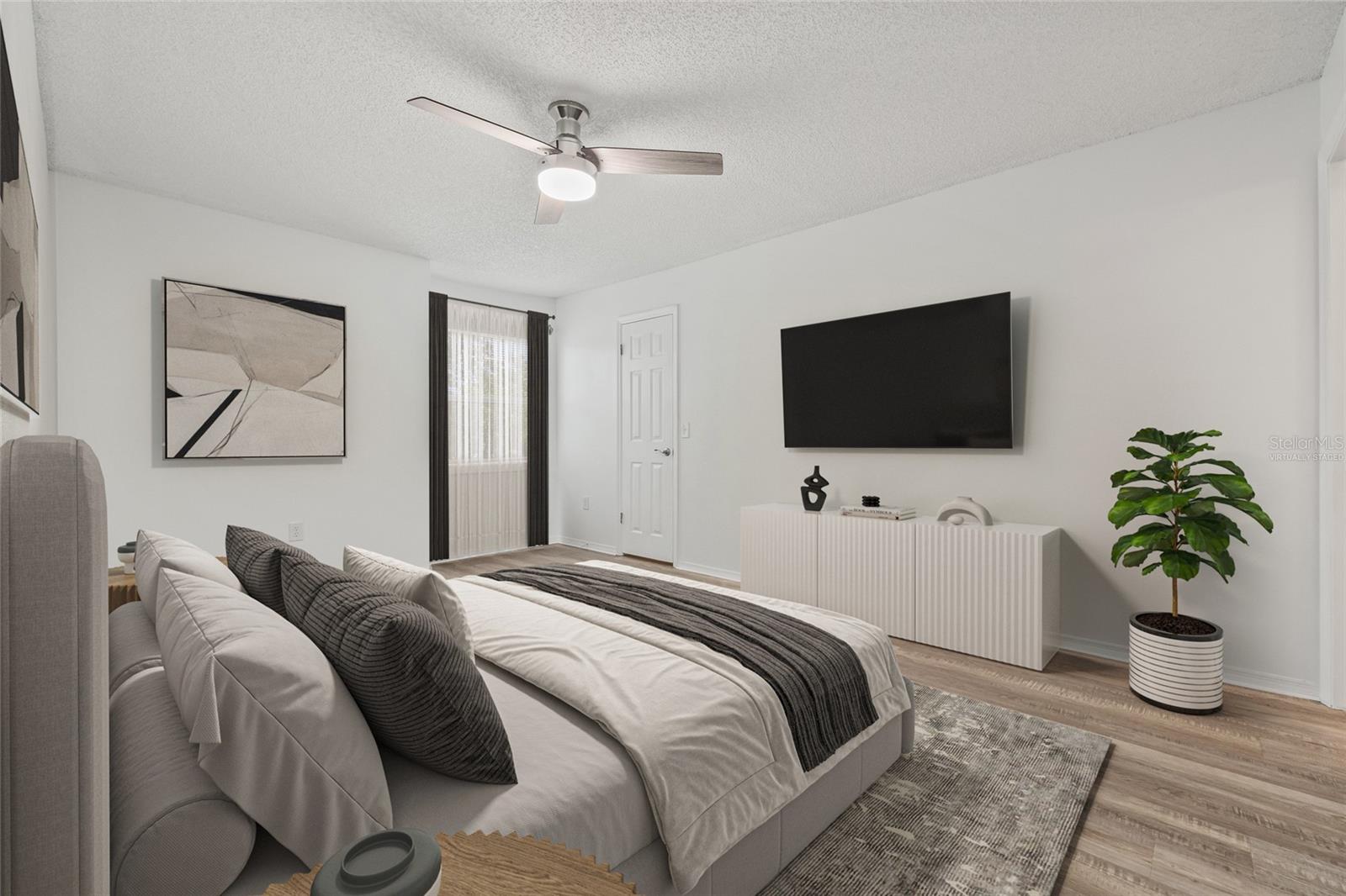 Virtually Staged Primary Bedroom. A glimpse into the potential of your personal retreat—this virtually staged primary bedroom with a walk-in closet and ensuite showcases how the space can be transformed into a cozy and elegant sanctuary.
