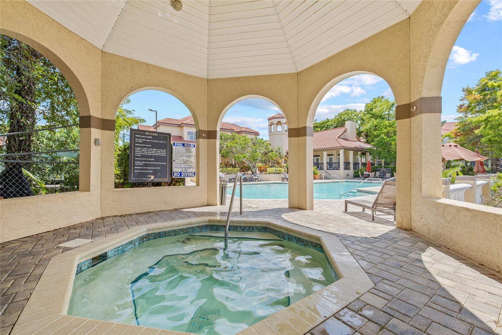 Covered Spa Retreat. Enjoy year-round relaxation in the shaded hot tub area nestled under a breezy gazebo.