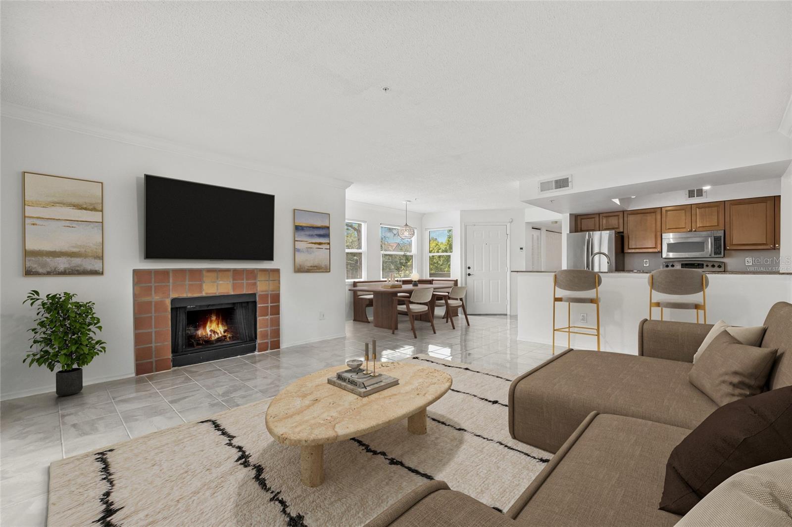 Virtually Staged Living Area. This layout showcases the inviting potential of the open living space, complete with a cozy fireplace and abundant natural light.