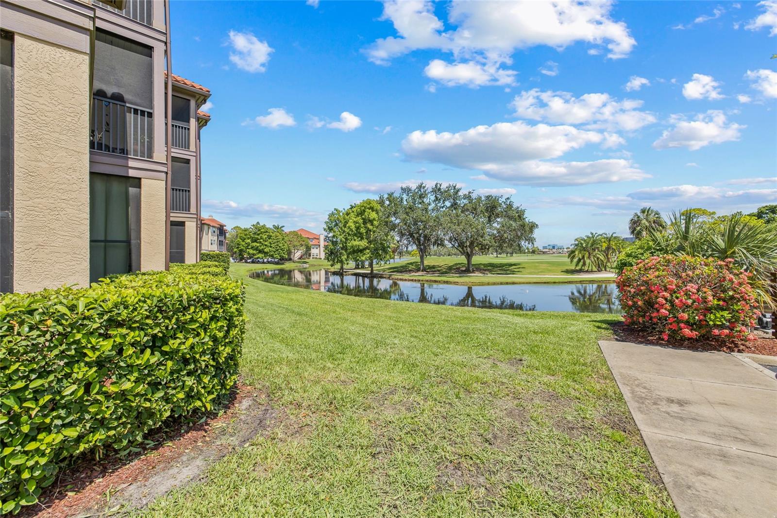 Manicured Grounds with Golf and Water Views. Enjoy a peaceful stroll or simply take in the lush scenery and serene waterfront just steps from your building.
