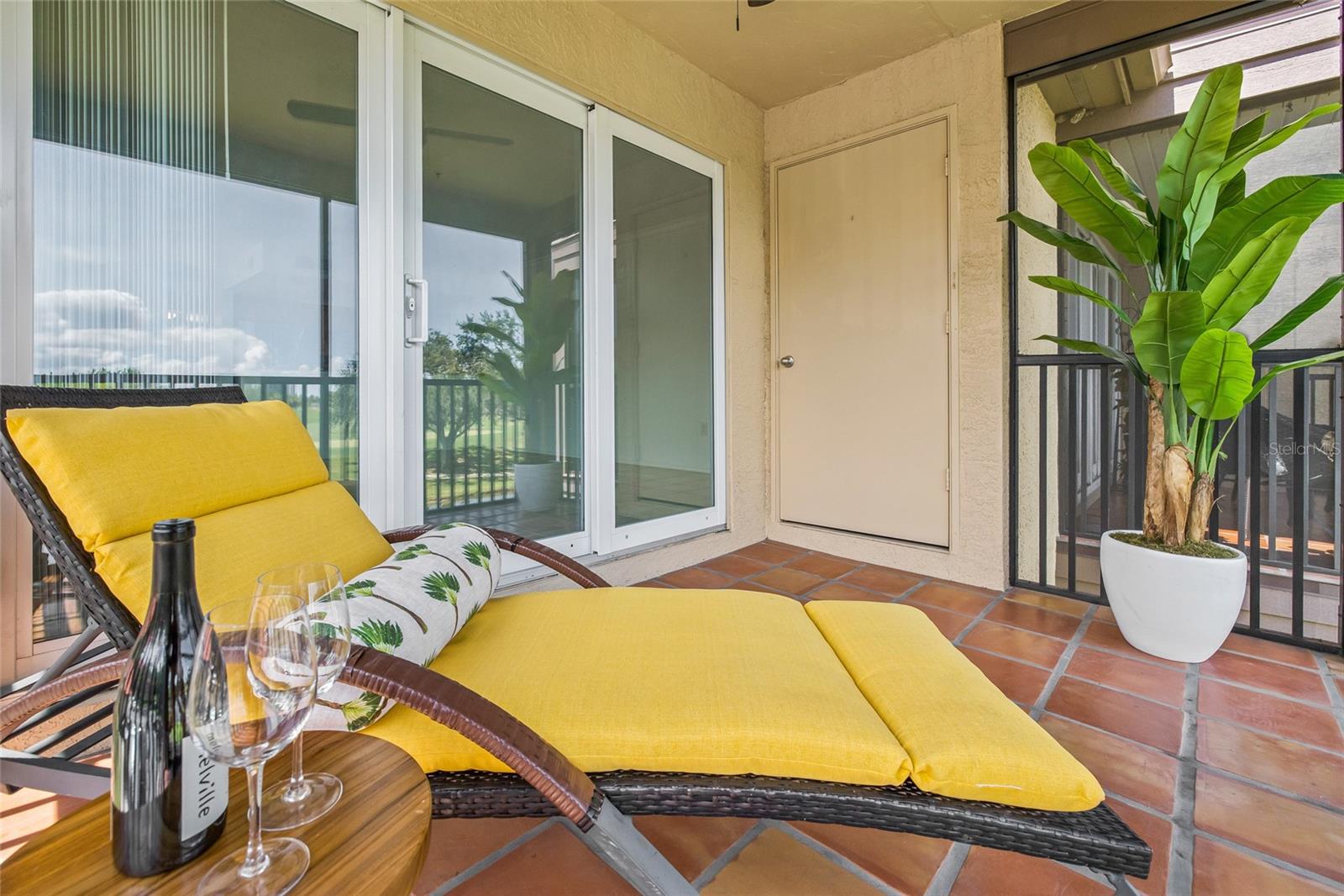 Comfortable Lanai Lounge Space. This private screened-in lanai offers a relaxing outdoor escape with space for seating, storage, and serene views.