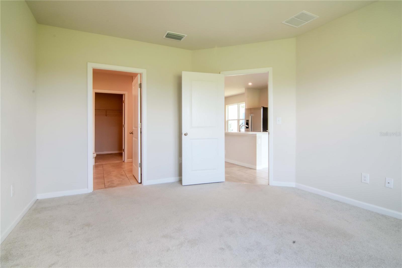 Primary bath on the left, kitchen and dining on the right