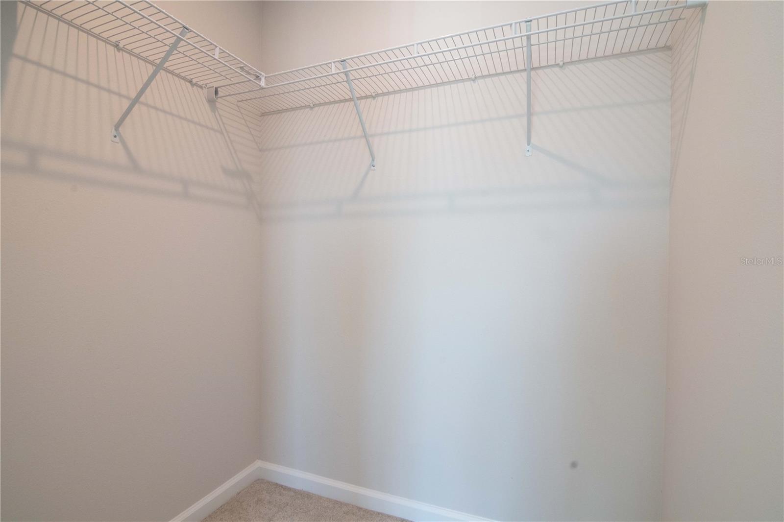 This bedroom walk-in closet