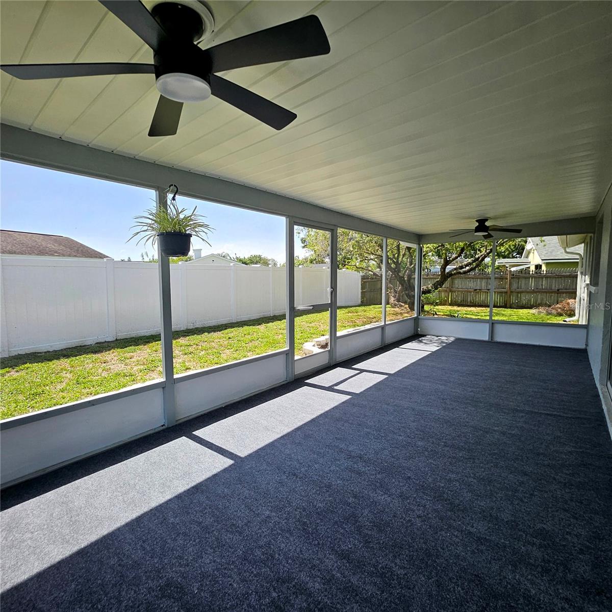 Back patio remodeled. New screens, ceiling fans, carpet, and paint.