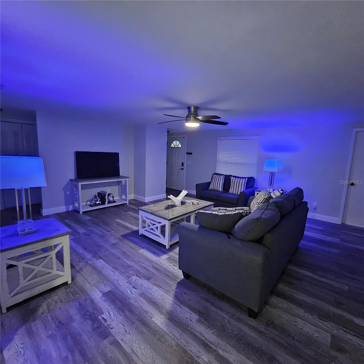 Lights change color to set mood in living area. Living room Furniture included. Move in ready.