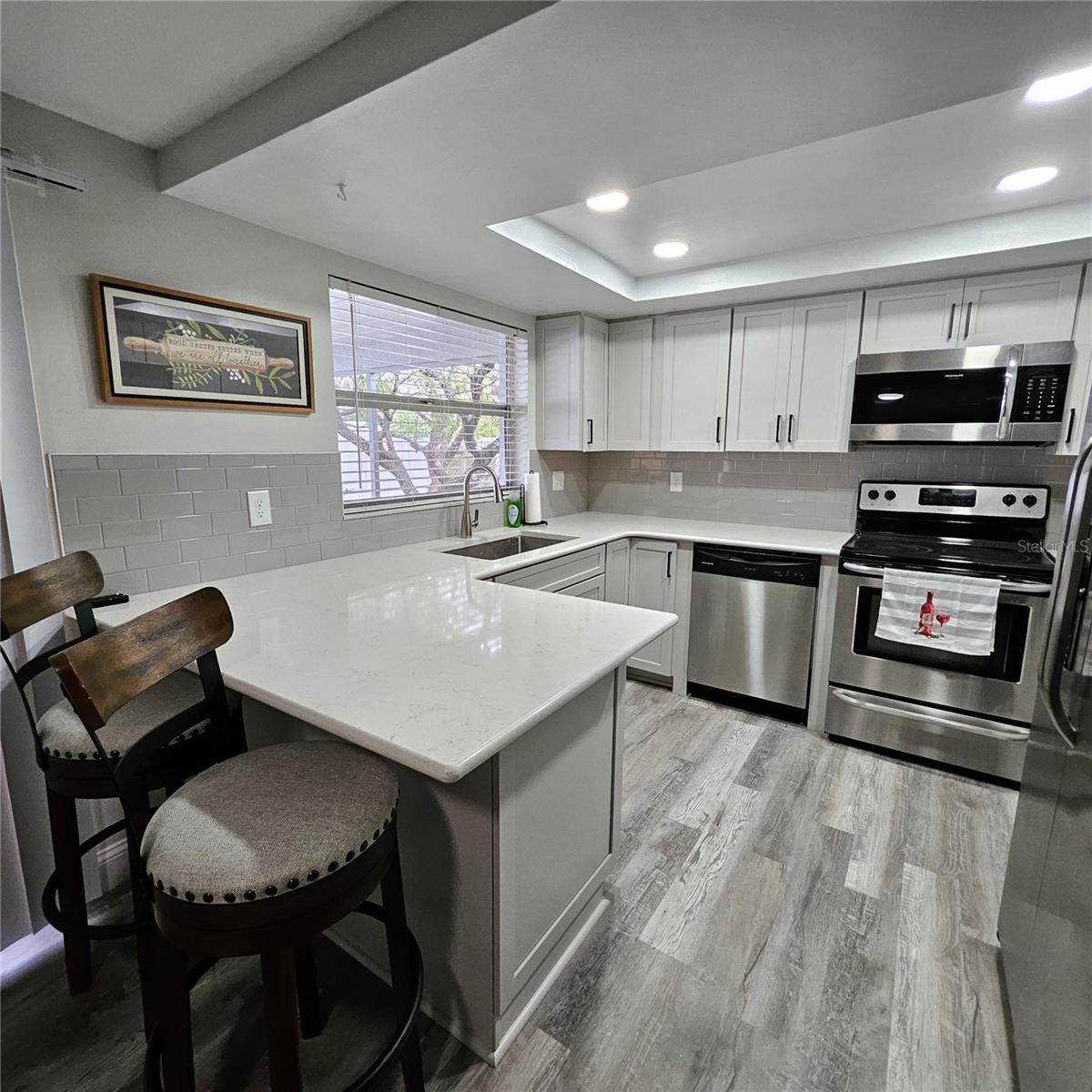 New Quartz Counter tops, backsplash, lighting, and cabinets