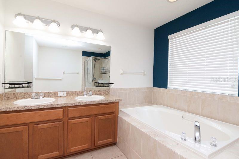 Primary Bathroom with dual vanity and soaking tub