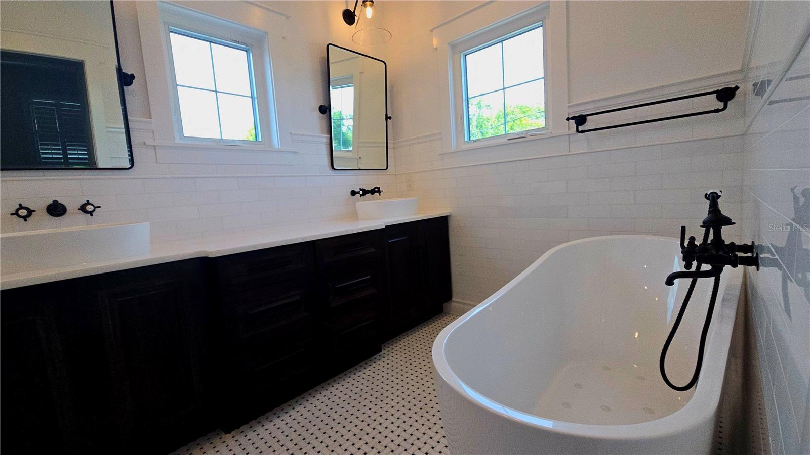 Primary Bath with Marbel double sinks counter tops and bubble tob