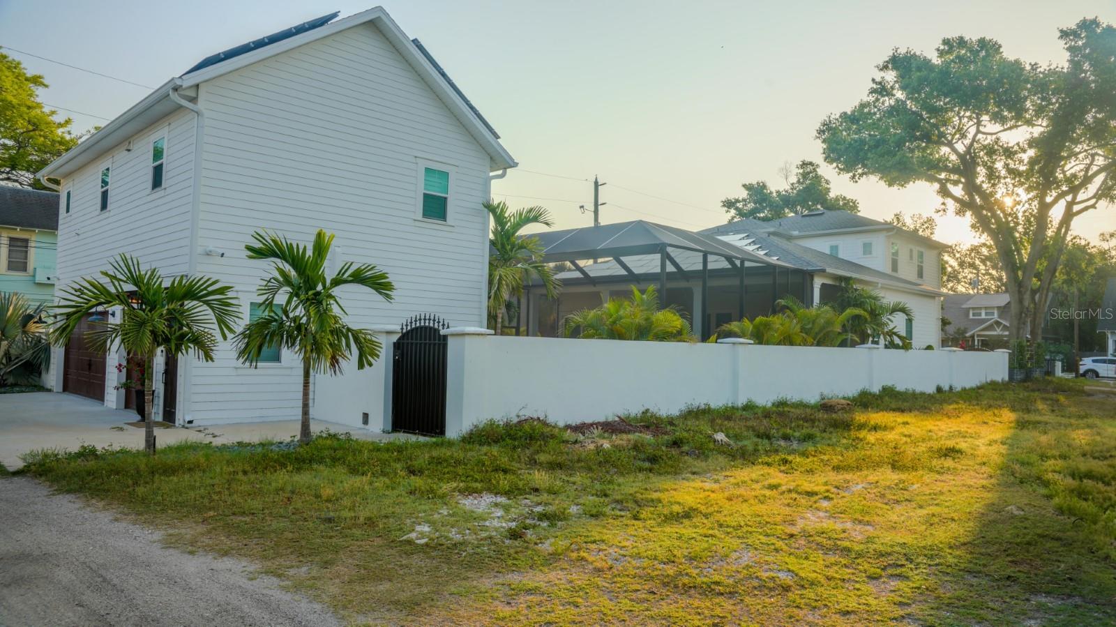 Three garages with concrete fence