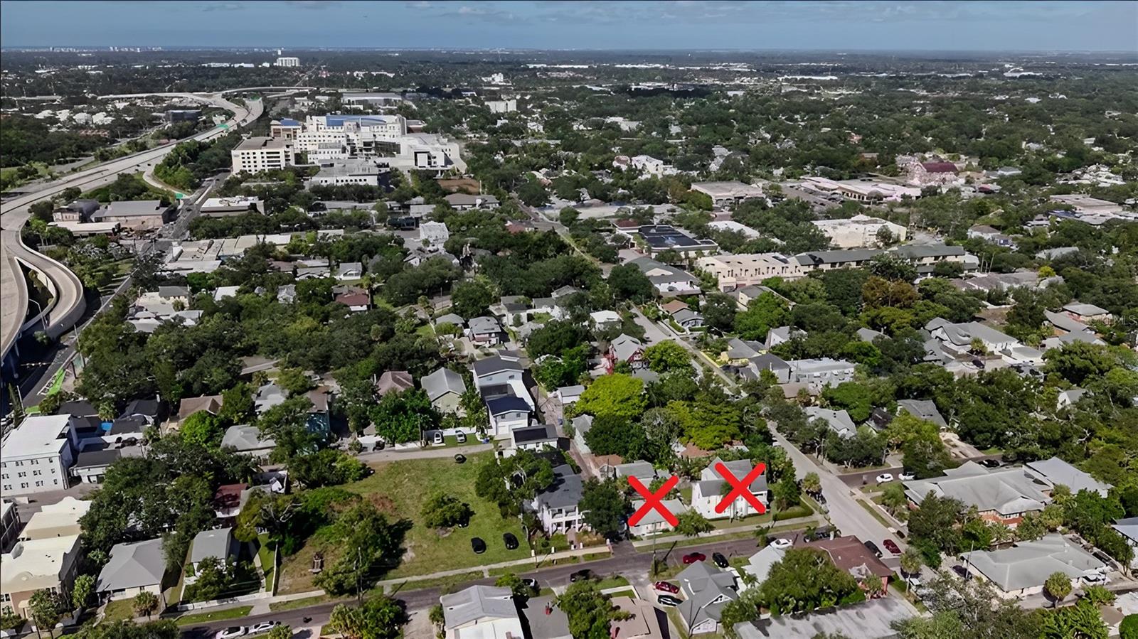 These two properties on the North Side across the brick alley being demolished for 4 luxury townhomes with garages! With downtown views from the drone.