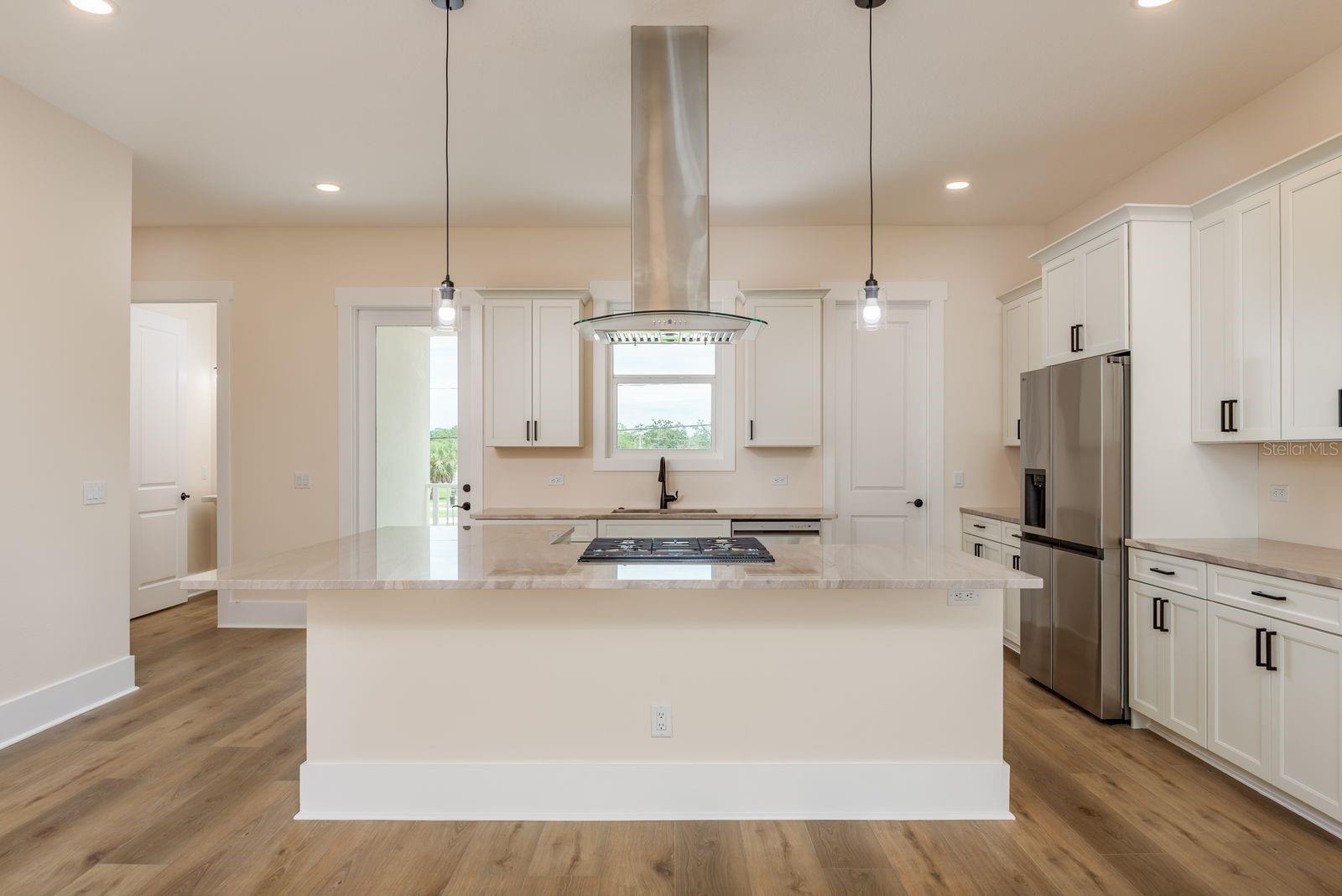 Features abundant natural light in the gourmet kitchen