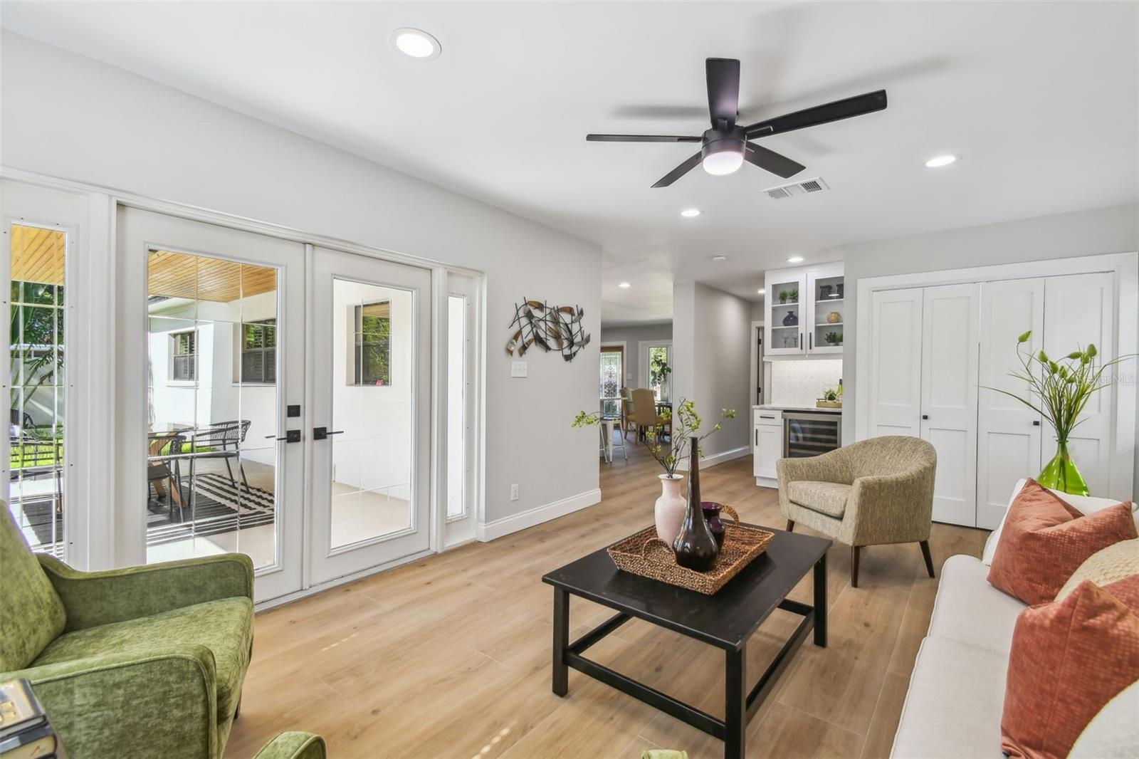 Stunning french doors allow for fabulous views of the covered porch and pool and allow for effortless fun!