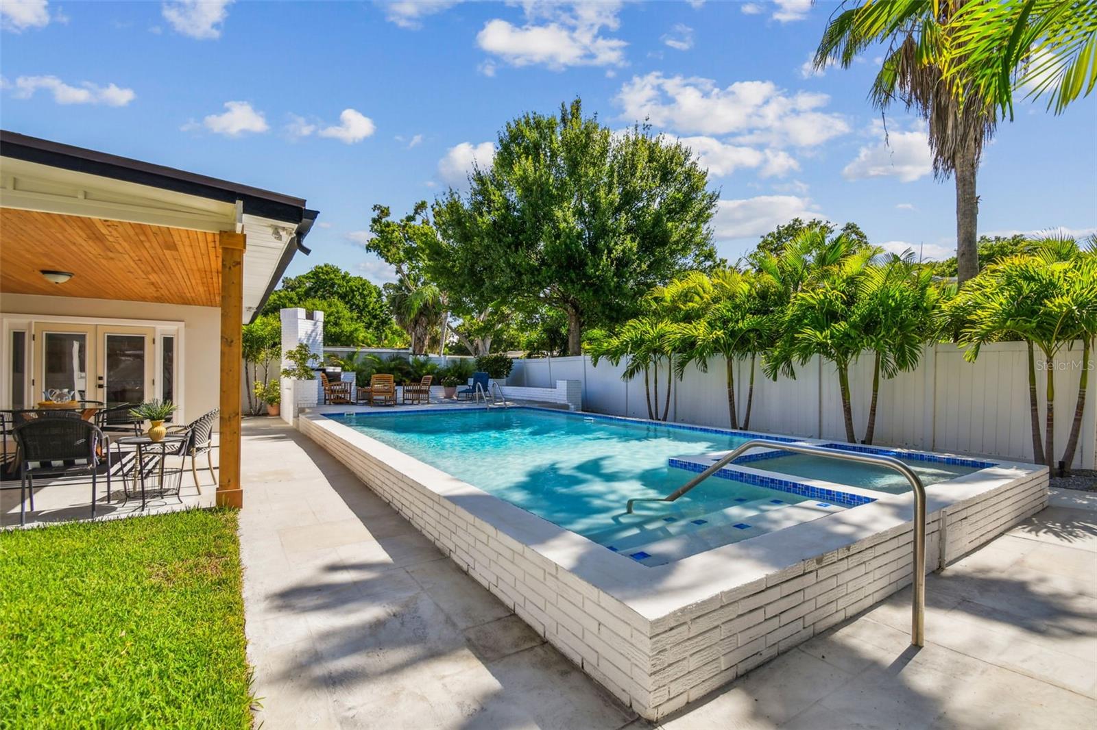 Uniquely designed pool and spa have been re-tiled and re-surfaced