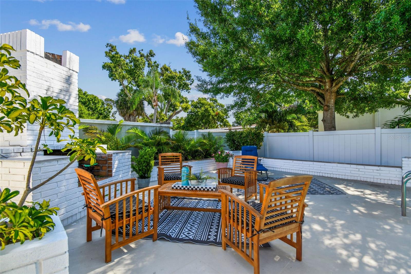 This home lives large with both covered porch and open, elevated patio and sun deck!