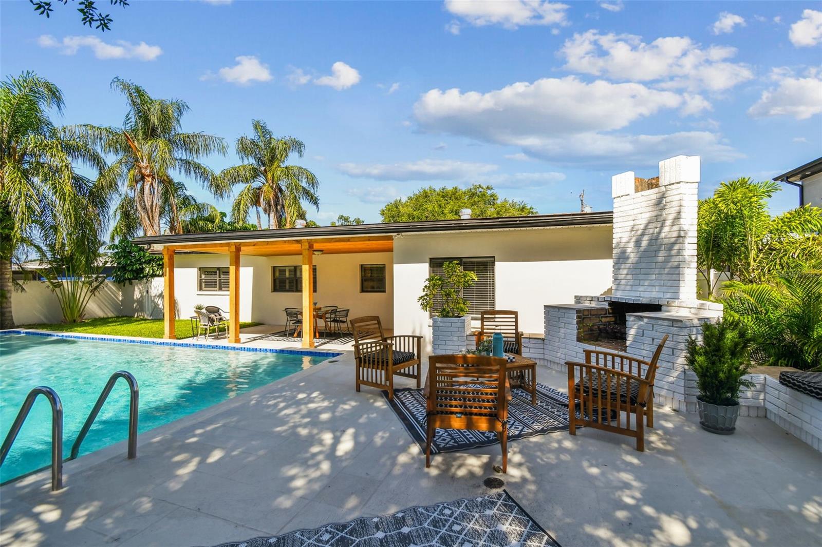 The elevated patio boasts room to entertain and sunbathe along with your built in fire pit or grill!