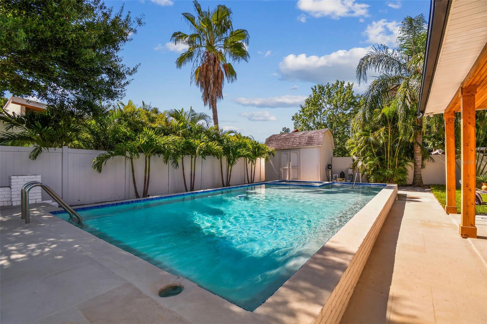 Newly planted palms surround this gorgeous space.